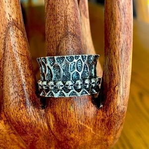 A ring with a ring of tiny skulls